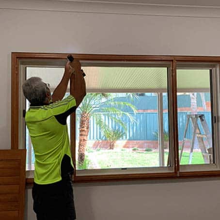 Installing Blinds — Shades and Awnings in Alice Springs, NT Installing Blinds — Shades and Awnings in Alice Springs, NT