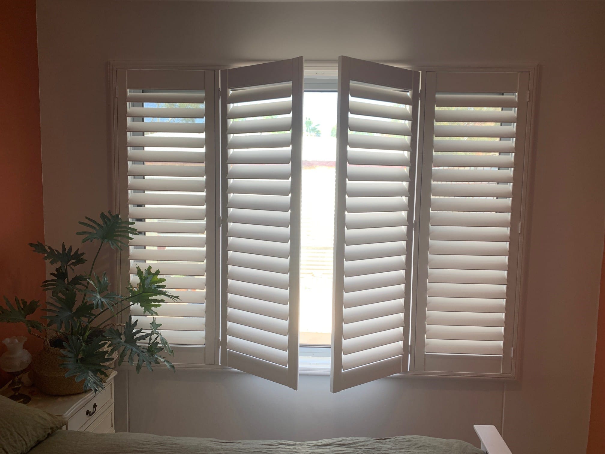 plantation shutters installed in home entrance way