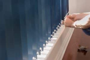 A Man Installing Blinds
