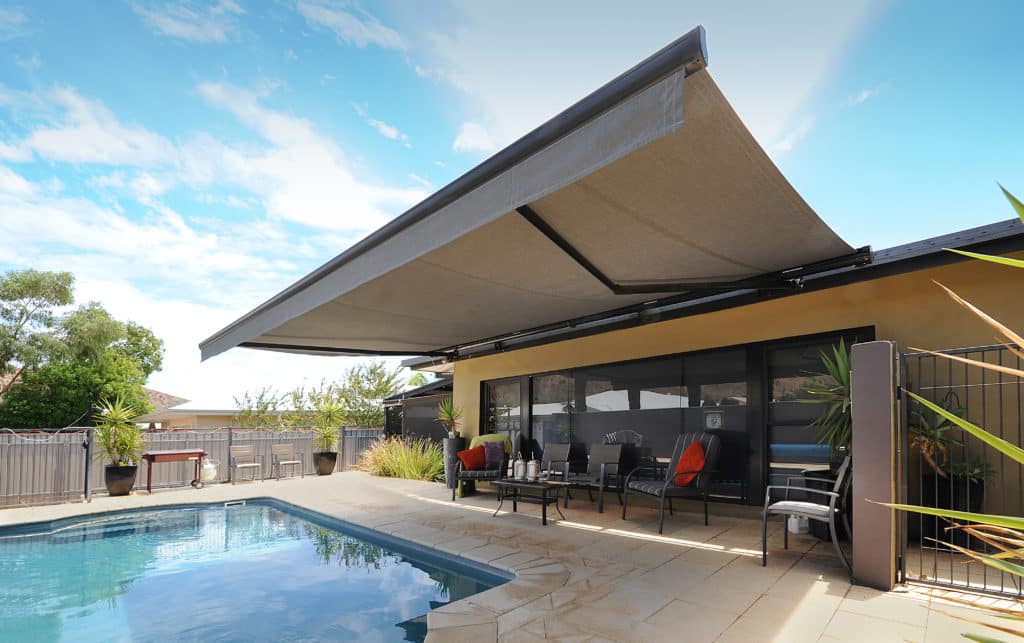 horizontal orientation of a pivot awning installed in an outdoor pool area in Alice Springs